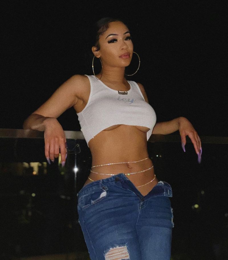 Saweetie Braless Boobs in a See Through Top.