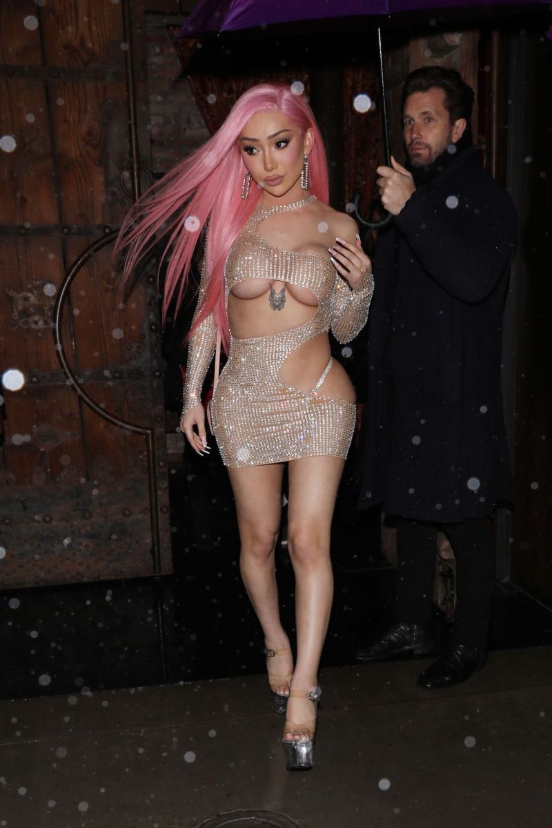 Nikita Dragun braless boobs in a see through dress showing off her big tits...