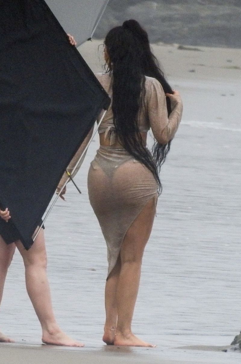 Kylie Jenner sexy see through photo shoot wet on the beach seen by paparazz...