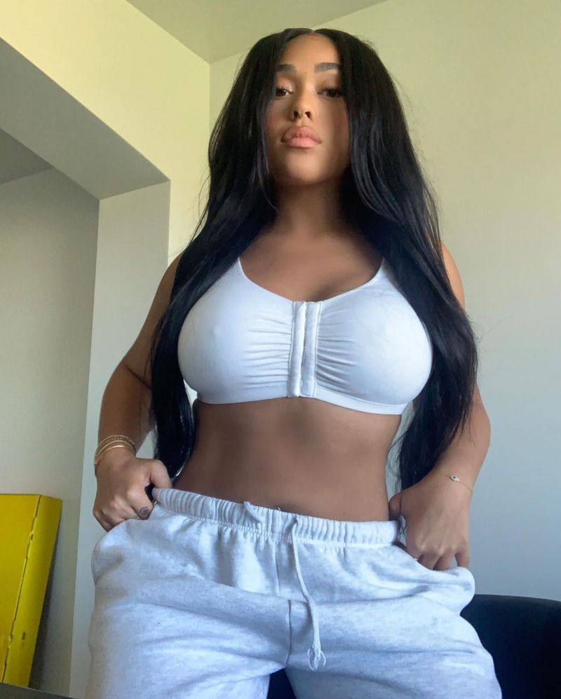 Jordyn Woods tits in a tight white little top showing off her big boobs and...